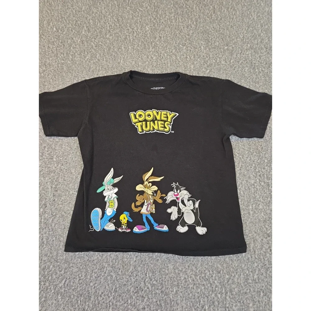 black Looney Tunes t-shirt features a graphic of Bugs Bunny, Wile E. Coyote,...